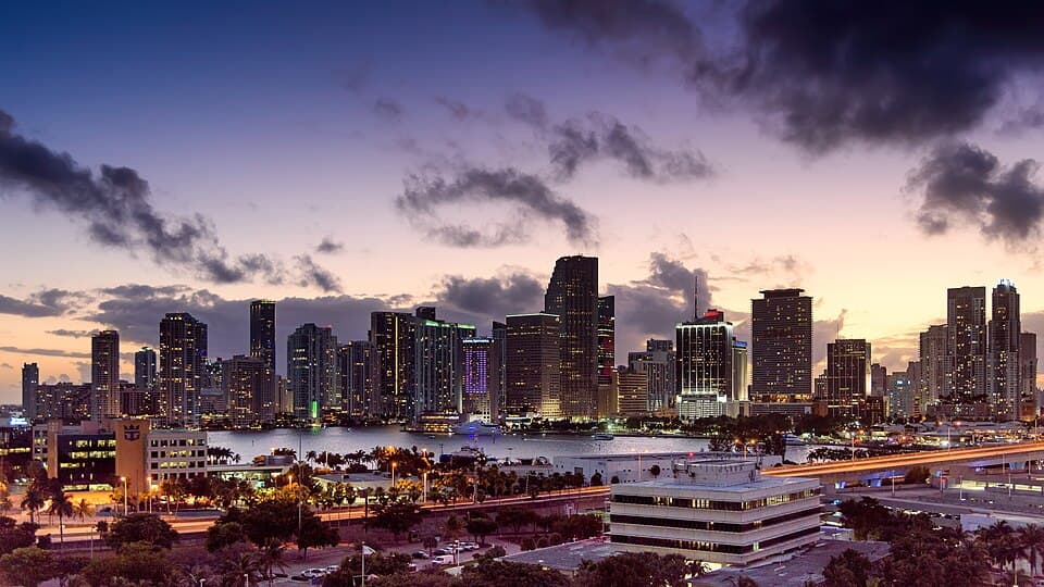 Downtown Miami skyline over Biscayne Bay at sunset at the start of a busy news week in South Florida.