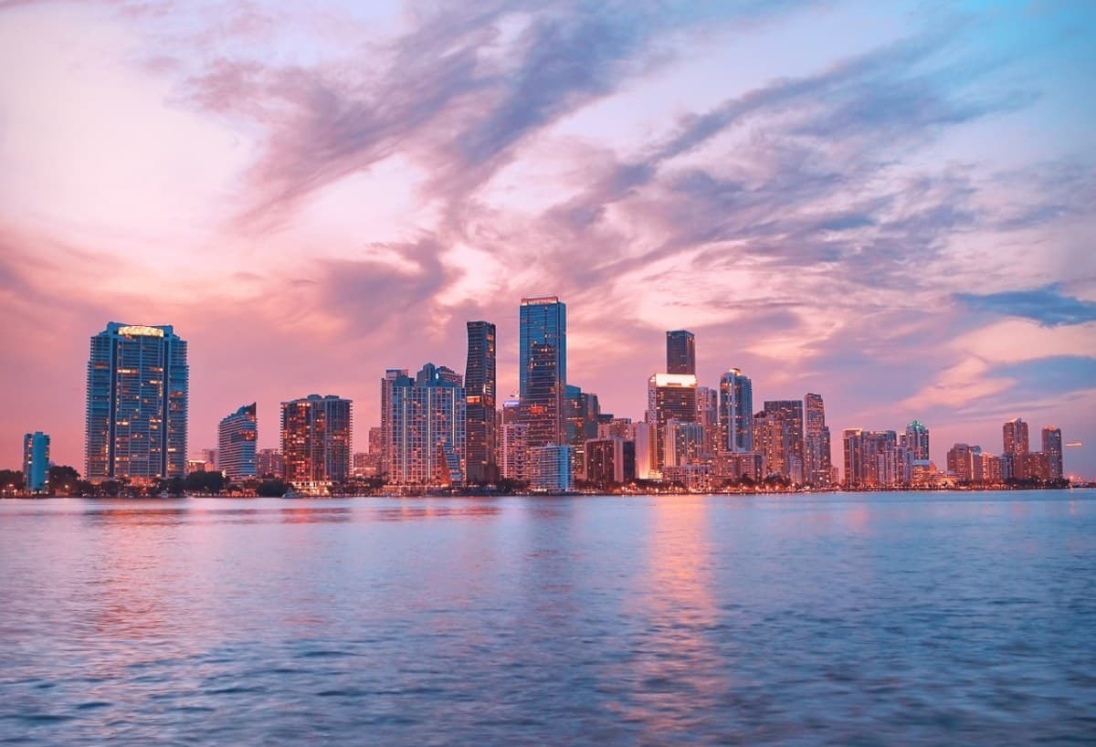 Miami skyline over Biscayne Bay at sunset — Miami is the county seat of Miami-Dade, the southern anchor of South Florida's three counties.